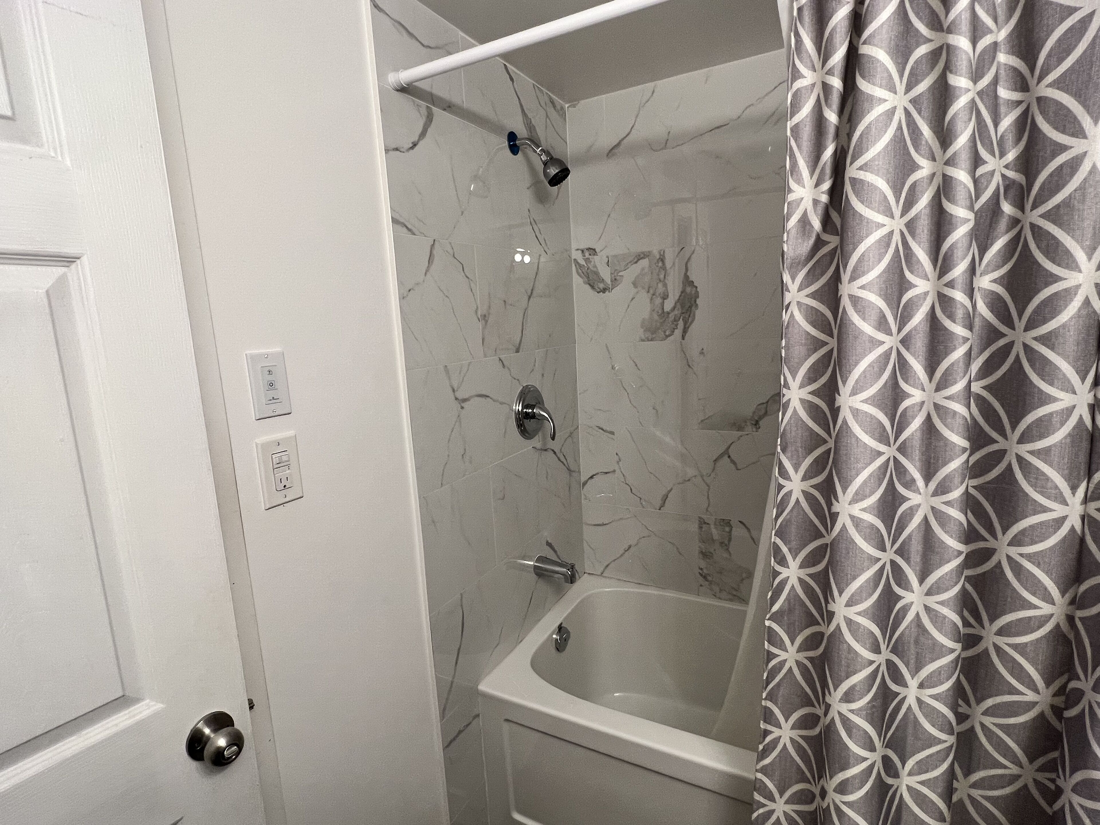 Combined shower/bathtub