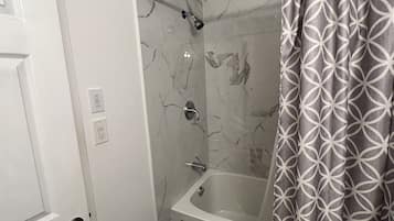 Combined shower/bathtub