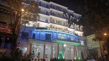 A multi-story hotel with a prominent sign reading "SONG HONG VIEW HOTEL".