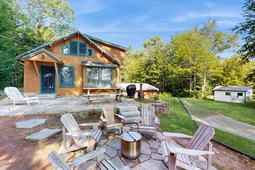 Belgrade Lakes getaway with private swim dock, outdoor living, & canoe/kayaks