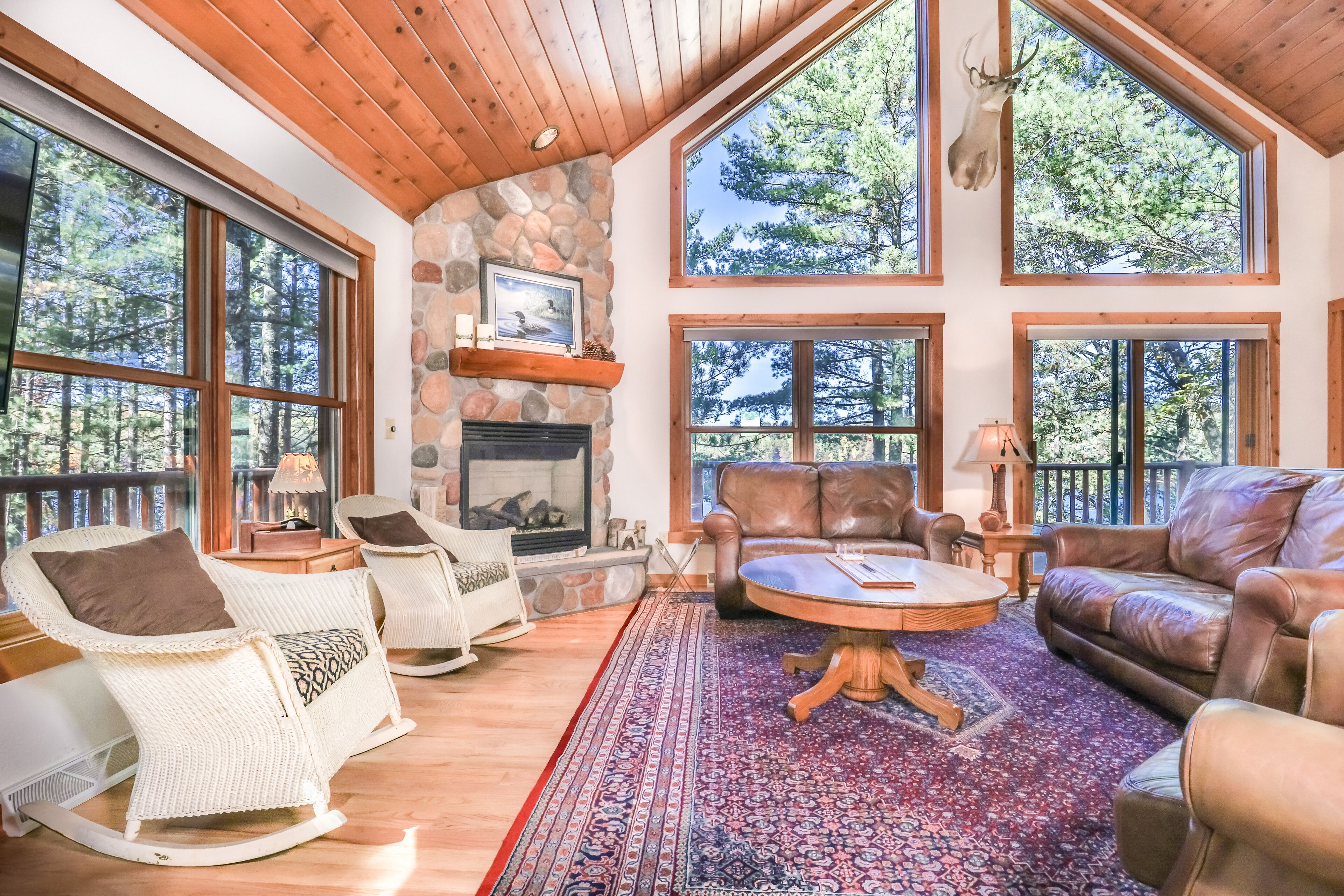 Gorgeous lakefront home with rowboat, fireplace, huge deck, W/D, & fast WiFi