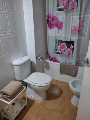 Bathtub, hair dryer, towels, soap