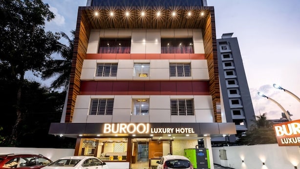 A multi-story building with a sign reading "BUROOJ LUXURY HOTEL". - Hotel Burooj (Kanayannur)