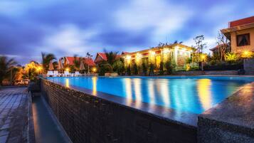 Outdoor pool, open 9:00 AM to 10:00 PM, free cabanas, pool umbrellas