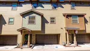 A two-story residential building with a garage, a covered entryway, and a small porch. - Luxurious AC Home Near Heart of Downtown, NAU, Snowbowl, Historic Route 66 (Flagstaff)