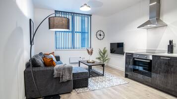 Luxury Apartment, 1 Double Bed with Sofa bed, Courtyard View | Living area | 40-inch flat-screen TV with satellite channels, TV