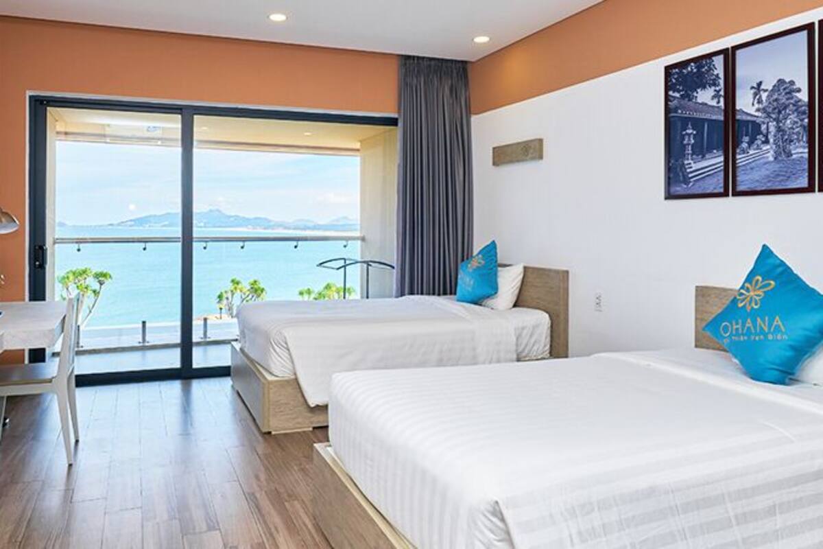Chambre Deluxe avec lits jumeaux, vue sur l’océan | Literie de qualité, lit avec matelas Select Comfort, minibar, bureau