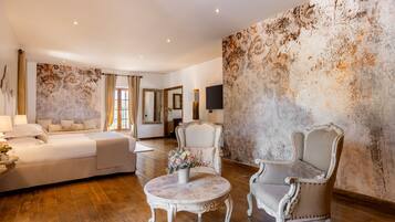Superior Suite | Minibar, in-room safe, individually decorated, individually furnished