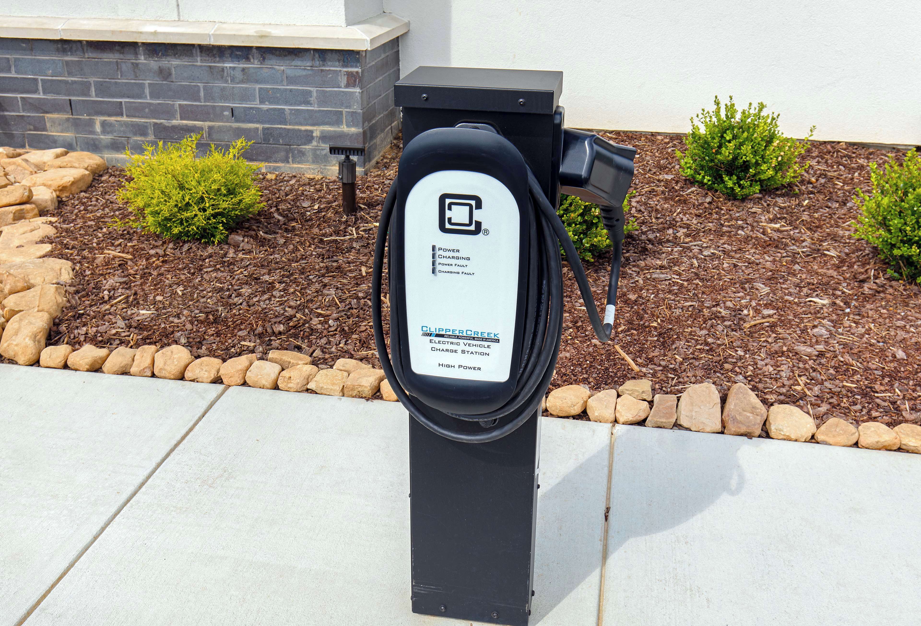 A black electric vehicle charging station with a label indicating it is a high-power station.