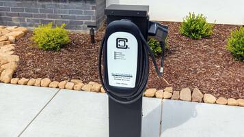 A black electric vehicle charging station with a label indicating it is a high-power station.