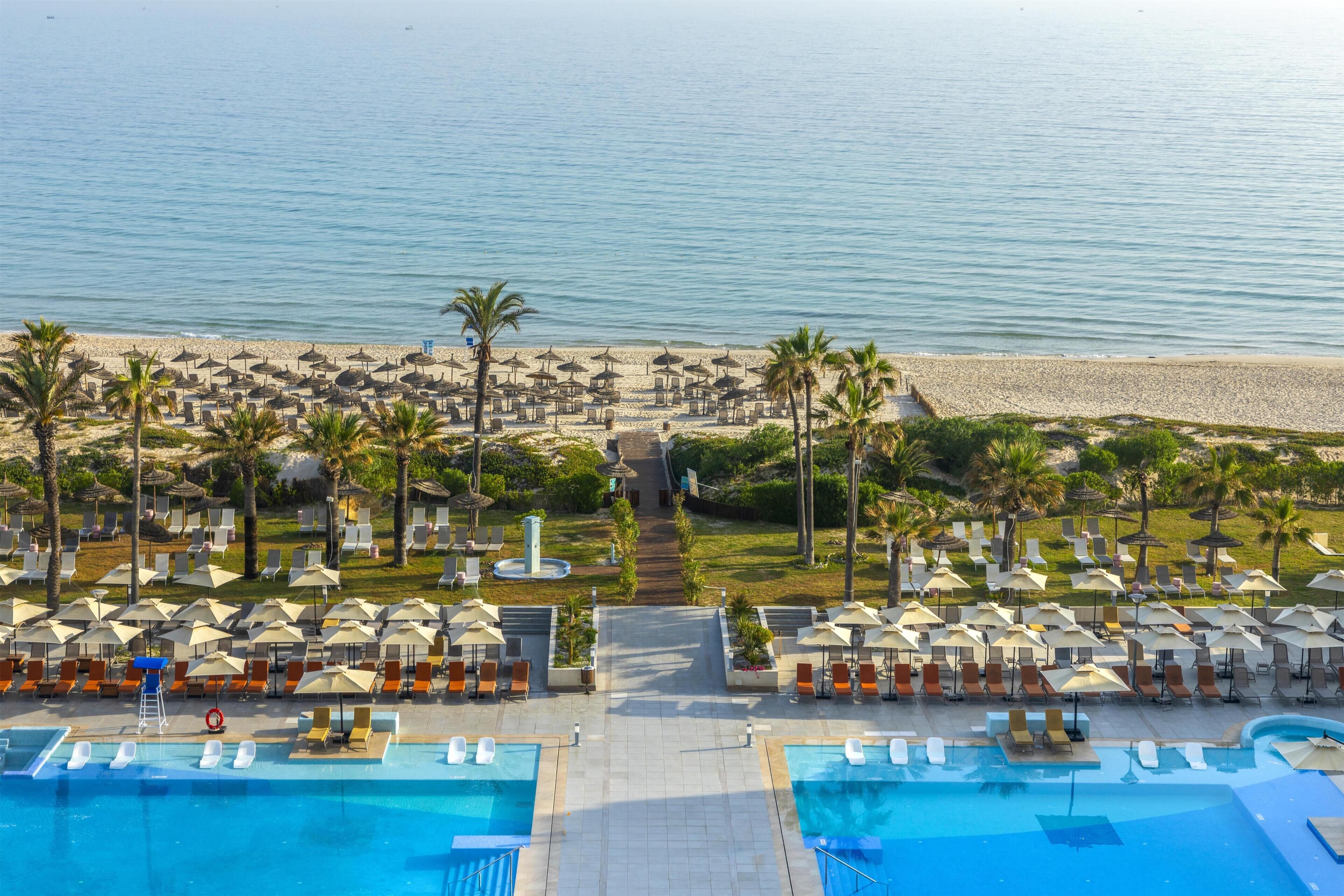 Private beach, white sand, sun loungers, beach umbrellas