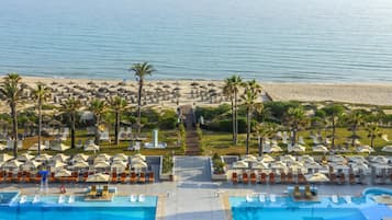 Private beach, white sand, sun loungers, beach umbrellas