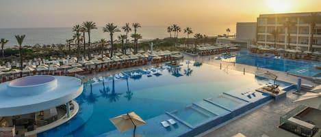 Indoor pool, 2 outdoor pools, pool loungers, lifeguards on site
