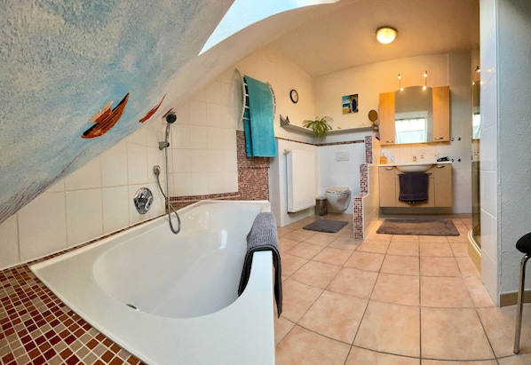 Bathtub, hair dryer, towels