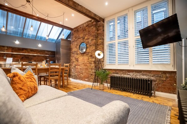 Superior Apartment, 2 Bedrooms | Living area | 42-inch flat-screen TV with cable channels, TV