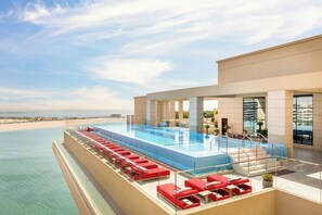 Outdoor pool, open 6:00 AM to 9:00 PM, pool umbrellas - Agora, Doha, Autograph Collection (Doha)