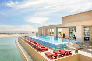 Outdoor pool, open 6:00 AM to 9:00 PM, pool umbrellas