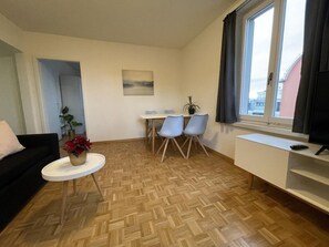Appartement, 2 grands lits | Salle de séjour