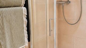 Shower, hair dryer, bathrobes, towels