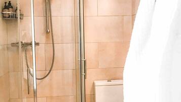 Shower, hair dryer, bathrobes, towels