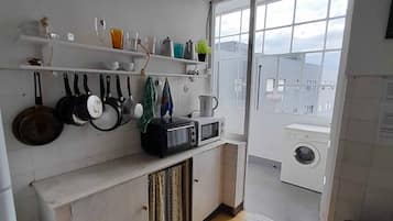 Fridge, microwave, toaster oven, cookware/dishes/utensils