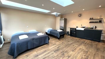 Kamar Triple Premium | Wi-Fi gratis dan seprai linen