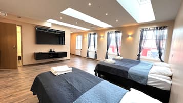 Kamar Triple Premium | Wi-Fi gratis dan seprai linen