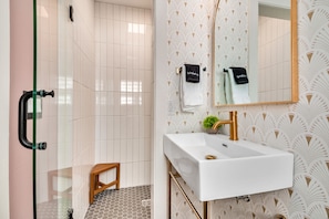 Combined shower/tub, hair dryer, towels, soap