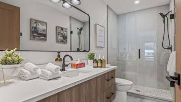Bathtub, hair dryer, towels, shampoo