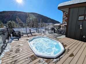 Relax in the hot tub surrounded by breathtaking mountain views.