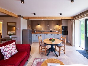 Enjoy cooking and dining in this well-equipped kitchen with a central island and adjacent dining area.
