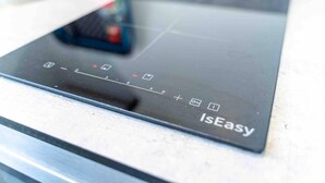 A black induction cooktop with a control panel labeled "IsEasy." - Cosy Ensuite Style Studio Close to University! (Birmingham)