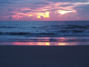Experience the serene tranquility of the ocean's gentle waves lapping onto the shore.