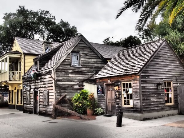 Situated on St. George Street, this historic building features a gabled roof and a charming front porch.