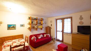 Apartamento | Área de estar | TV 30 polegadas com canais a cabo