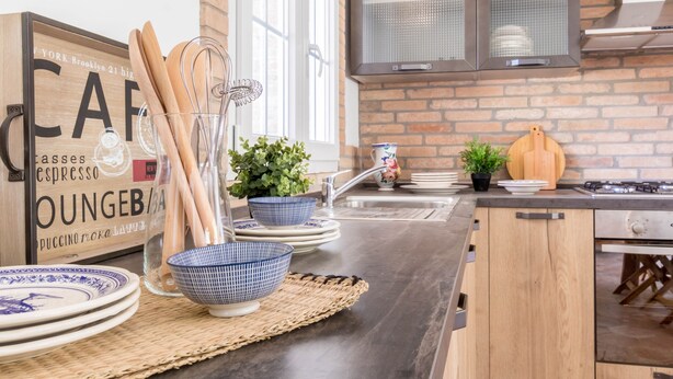 A kitchen with a brick wall, wooden cabinets, and a stainless steel countertop. - JOIVY Superb Villa For 7 W/Backyard And Bbq Area In Vaccarezza (Bobbio)