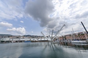 Stunning marina with a striking central structure surrounded by calm waters and docked boats.