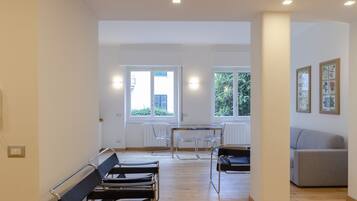Apartment, 3 Bedrooms | Living area | 24-inch flat-screen TV with cable channels