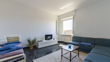 Apartment | Living area | 24-inch flat-screen TV with cable channels