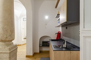 Apartment | Private kitchen | Mini-fridge, microwave, stovetop, cookware/dishes/utensils
