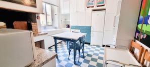 Apartment | Private kitchen | Espresso maker, dining tables