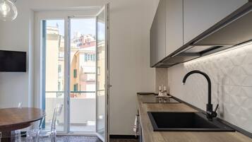 Apartamento | Cozinha privada | Mesas de jantar