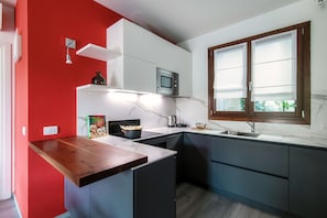 Apartamento | Cozinha privada | Geladeira, fogão, cooktop, lava-louças