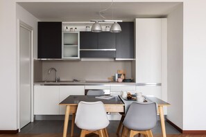 Apartment | In-room dining - JOIVY Superb Flat W/Home Office (Milan)