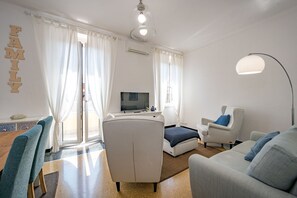 Comfort Apartment | Living area | 32-inch Smart TV with cable channels, TV - JOIVY Penthouse Flat W/Terrace (Genoa)