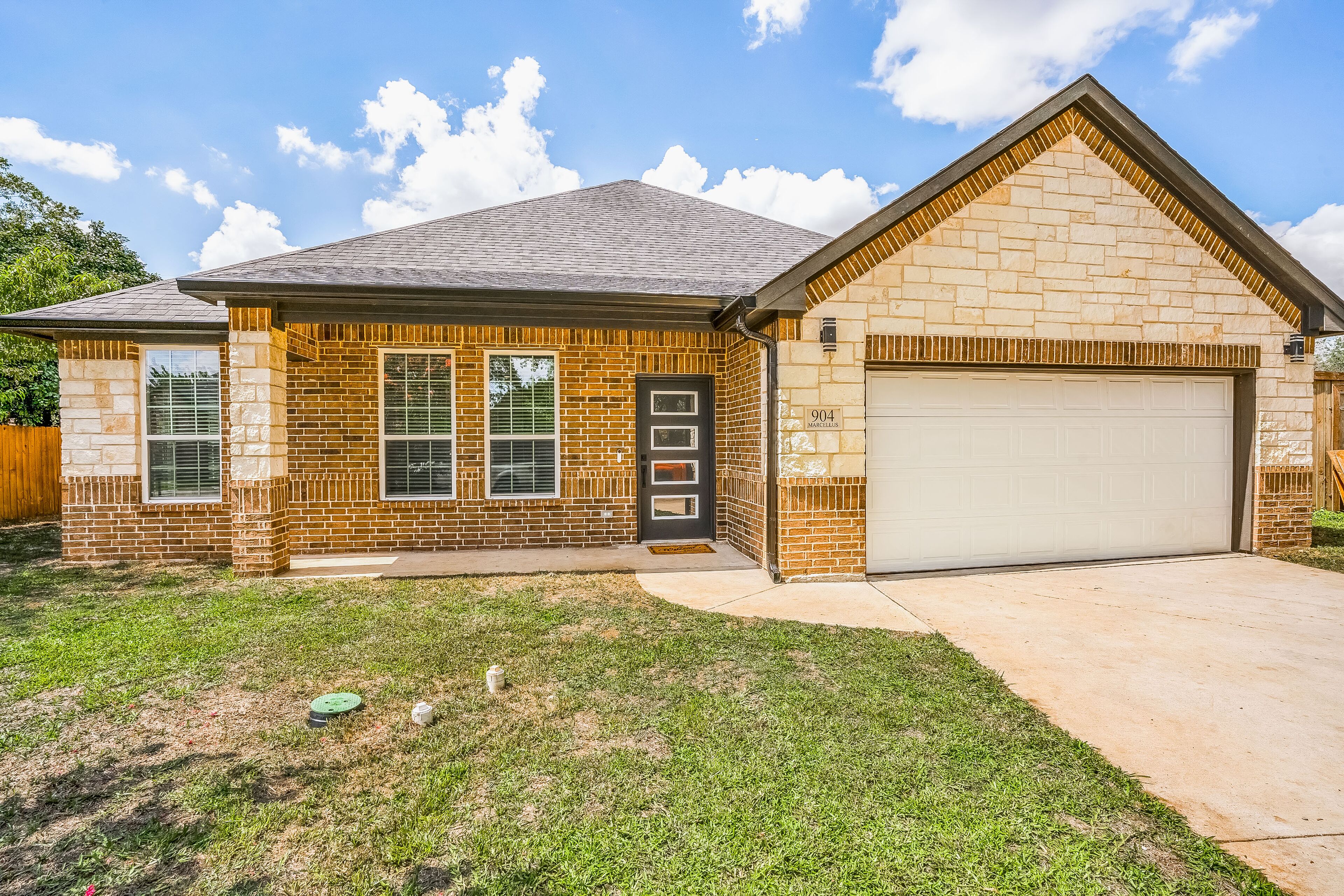 Newly-built, dog-friendly home with a fenced yard, washer/dryer, & central AC