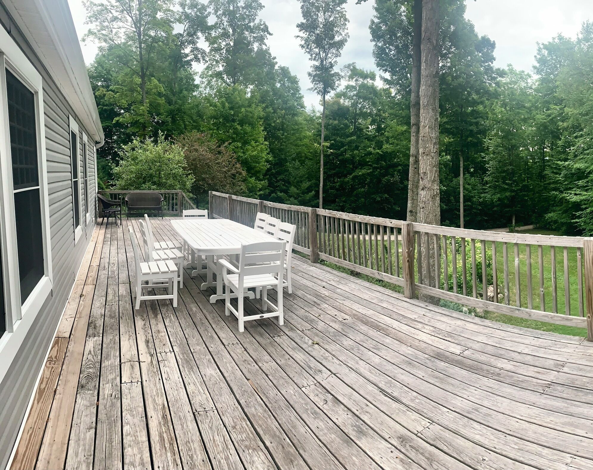 Expansive front deck, overlooking large private yard