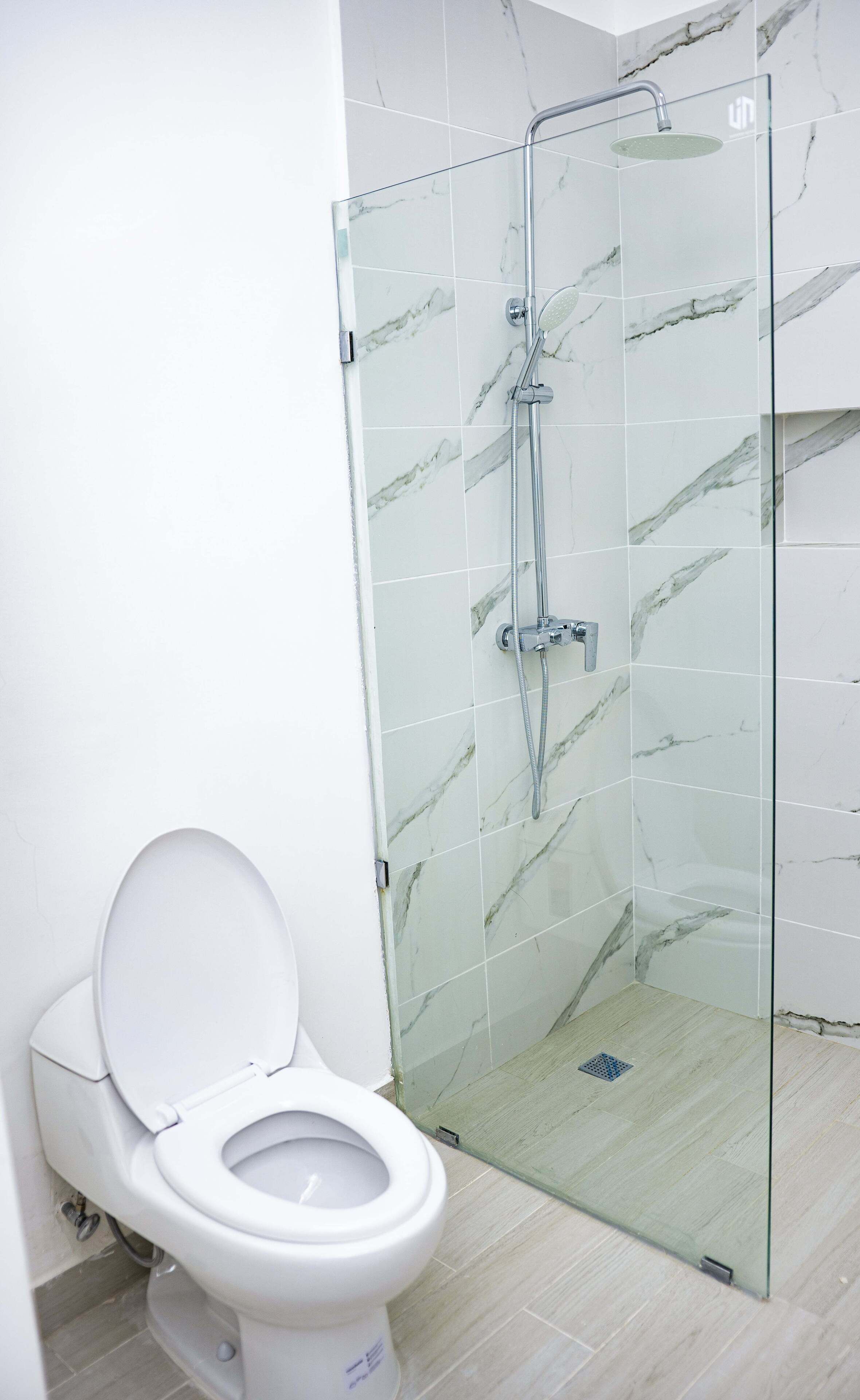 shower, rainfall showerhead, hair dryer, towels