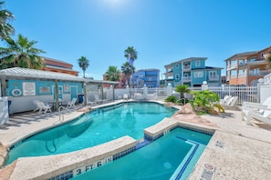 A swimming pool with a 3 FT 6 IN depth marker, surrounded by lounge chairs and a white fence.