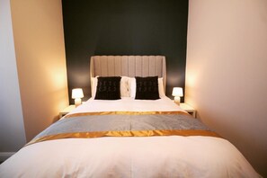 2 bedrooms, desk, blackout curtains, iron/ironing board